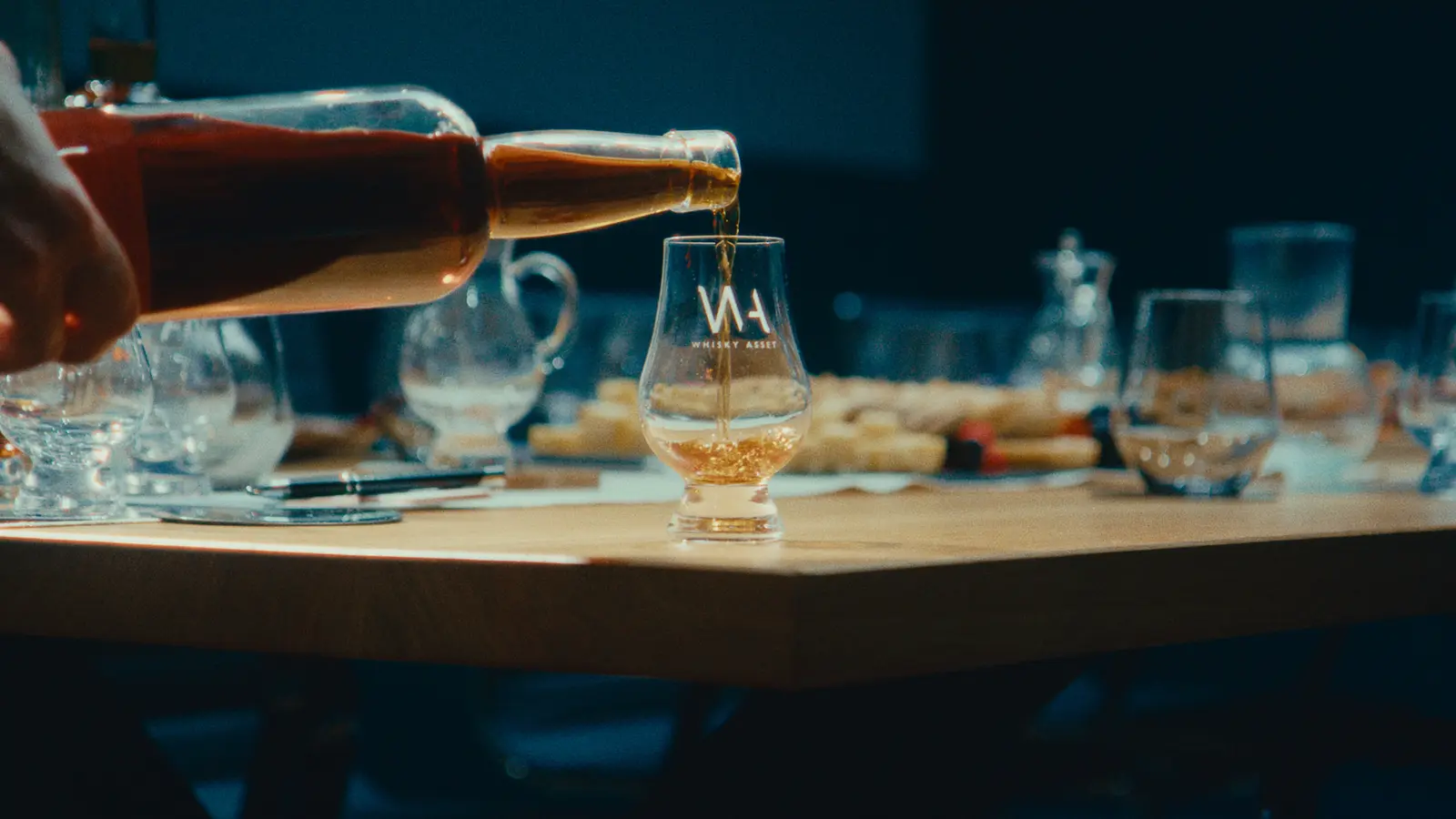 Bottling and whisky pouring detail